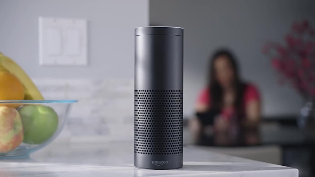 A black Amazon Echo on a table as one of gift ideas for your friends